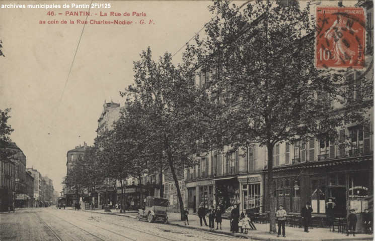 Rue de Paris à l'angle de la rue Charles-Nodier.