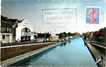 Canal de l'Ourcq avec en premier plan le cinéma Pantin-Palace et en arrière-plan les entrepôts de la Chambre de commerce et d'industrie de Paris : carte postale colorisée.