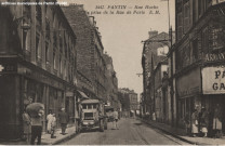 1447. Pantin - Rue Hoche prise de la rue de Paris (Pharmacie principale de Pantin).